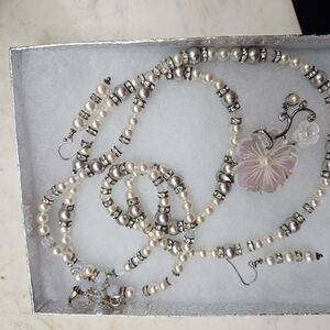 Elegant Pearl and Silver Necklace with Floral Pendant